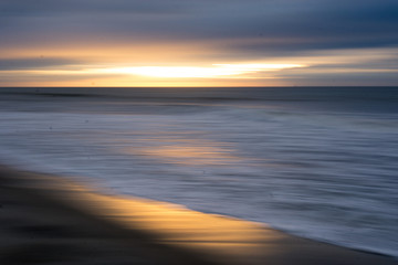 Fototapeta na wymiar Blurred Beach at Sunset