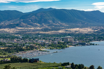Fototapeta na wymiar Magnificent view over Okanagan lake and valley with high clouds in the sky