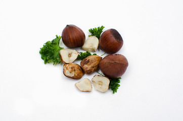  hHazelnuts with leaves with copy space for your text isolated on white background. Top view