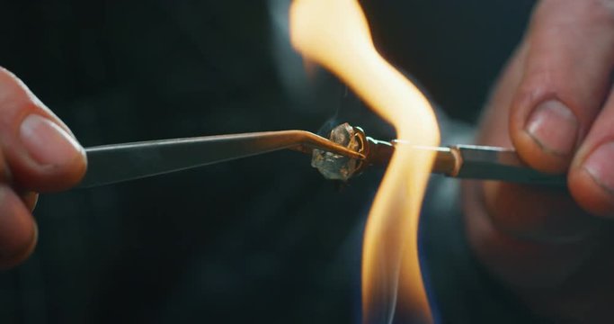 Slow motion macro of experienced goldsmith working on high quality aquamarine stones selected for making precious jewels in workshop. Shot in 8K.Concept of jewelry, luxury, goldsmith, diamonds