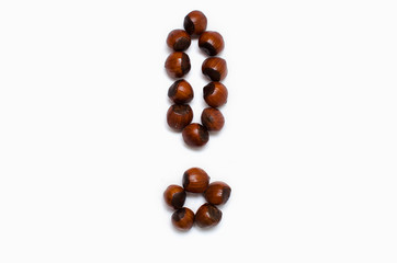 the exclamation mark is lined with hazelnut on white background, with a place for the text 