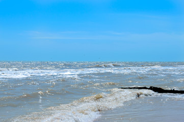 Fototapeta premium Waves on the shore. Sea wave with sunlight. Beautiful view of the sea and blue sky. Seascape.