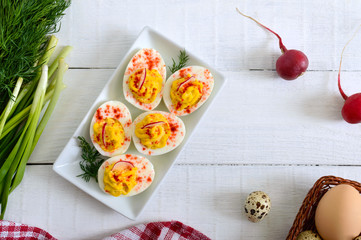 Deviled eggs. Delicious appetizer. Boiled eggs stuffed with yolk, mustard, mayonnaise, paprika. Classic recipe. The top view