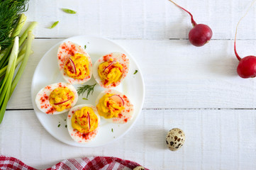 Deviled eggs. Delicious appetizer. Boiled eggs stuffed with yolk, mustard, mayonnaise, paprika. Classic recipe. The top view