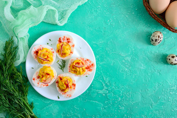 Deviled eggs. Delicious appetizer. Boiled eggs stuffed with yolk, mustard, mayonnaise, paprika. Classic recipe. The top view