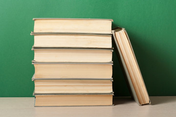 Stack of books on wooden table. Education concept. Back to school.