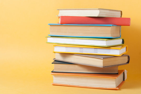 Stack of colorful books. Education background. Back to school. Copy space for text.