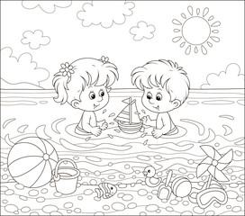 Happy little kids playing with toys in water on a sea beach on a sunny summer day, black and white vector illustration in a cartoon style for a coloring book