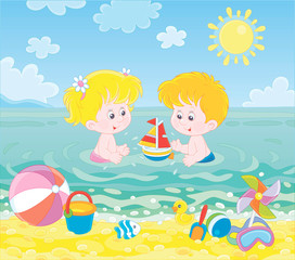 Obraz na płótnie Canvas Happy little kids playing with toys in blue water on a sea beach on a sunny summer day, vector illustration in a cartoon style