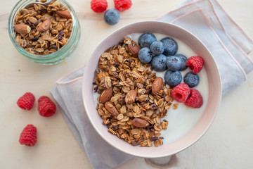 Healthy breakfast super food cereal concept with fresh fruit, granola, yoghurt