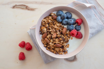 Healthy breakfast super food cereal concept with fresh fruit, granola, yoghurt