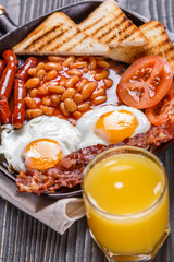 delicious English breakfast on a dark rustic background