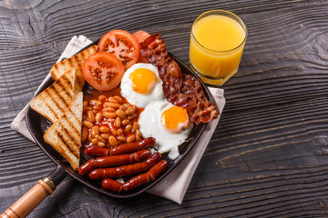 delicious English breakfast on a dark rustic background