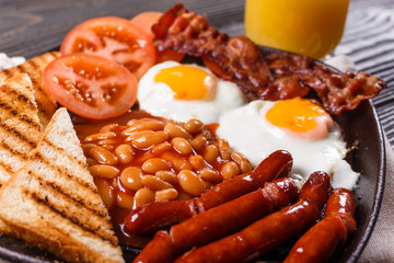 delicious English breakfast on a dark rustic background