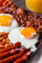 delicious English breakfast on a dark rustic background