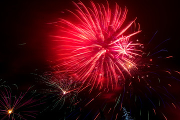 Fototapeta premium Beautiful sparks from fireworks in the sky at night
