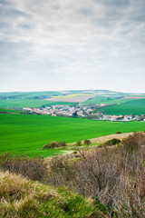 Fototapeta na wymiar view on the landscape and the village l' Escale when mounting the cliff of Cap Blanc Nez in springtime in the region of Nord Pas de Calais