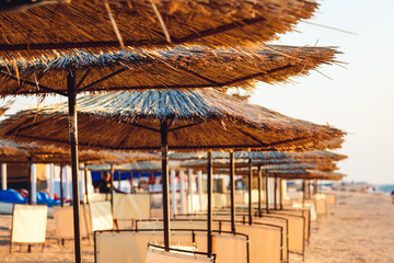 photos of reed beach umbrellas in perspective.