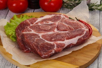 Raw pork neck steak