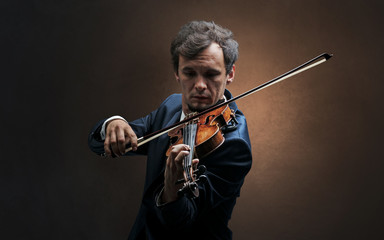 Lonely violinist composing on cello with nothing around
