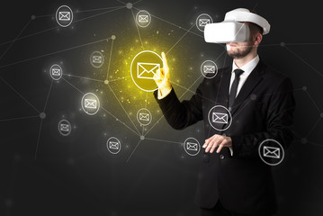 Young businessman in virtual reality glasses organize online network communication