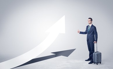 Young businessman hitchhiking with progressive arrow concept and copyspace
