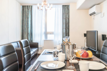 A set of dishes and a glass of wine on the dinner table