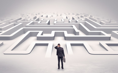 Businessman getting ready to enter a 3D flat labyrinth concept
