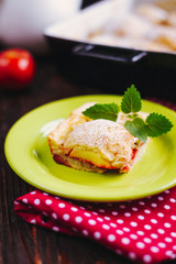 A slice of apple pie with mint