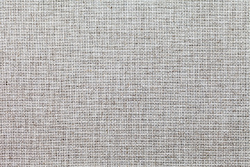 Special cloth for cross-stitch embroidery with square mesh pattern linen canvas. Fabric  background. Template for text or advertising sewing and needlework. Top view, flat lay