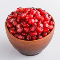 grains of a grenade on a white acrylic background