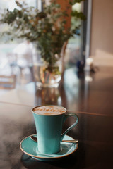 A cup of coffee on the table in a cafe