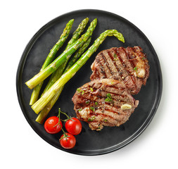 plate of grilled steaks on white background