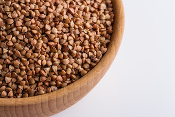 Grain buckwheat on a white acrylic background