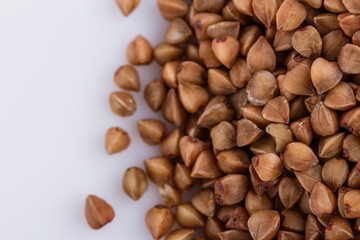 Grain buckwheat on a white acrylic background