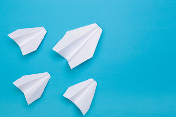 winner  paper aircraft on blue background