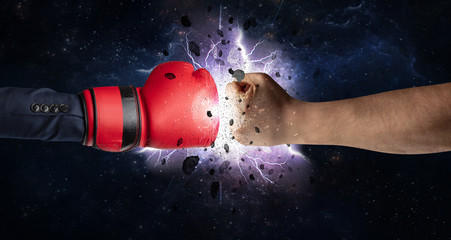 Fototapeta na wymiar Two hands fighting with storm explosion concept 