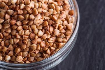 Grain buckwheat on a dark stone background