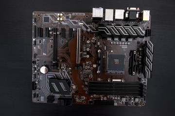 Computer motherboard on dark background, close up