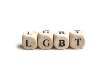 concept word forming with wooden cube on white background - LGBT