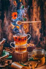 magic forest tea with smoke and honey dark bright still life