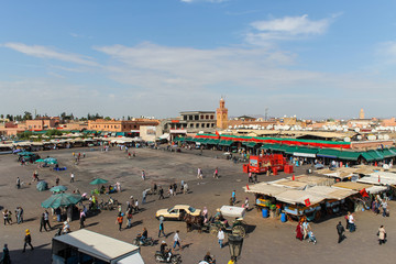 Fototapeta na wymiar Jamaa el Fna market square during daytime, Marrakesh, Morocco, north Africa. Jemaa el-Fnaa, Djema el-Fna or Djemaa el-Fnaa is a famous square and market place in Marrakesh's medina quarter.