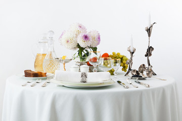 table with dishes and flowers