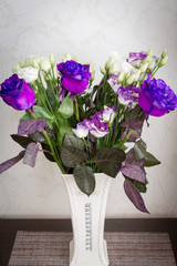 A beautiful bouquet of fresh pink roses in an expensive vase