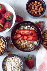 Muesli with nuts and strawberries for Breakfast top view
