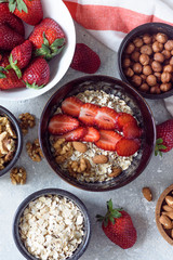 Muesli with nuts and strawberries for Breakfast top view