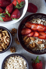 Muesli with nuts-almonds,hazelnuts and strawberries for Breakfast top view