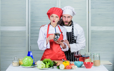 Preparation and culinary concept. happy couple in love with healthy food. man and woman chef in restaurant. Family cooking in kitchen. vegetarian. cook uniform. Dieting and vitamin. culinary cuisine