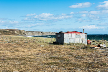 Fototapeta na wymiar Fisherman's cottage near the coast in Tierra del Fuego