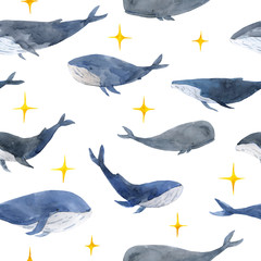 Seamless pattern of watercolor calm whales in gray and blue tones, and with shine yellow sparkles.